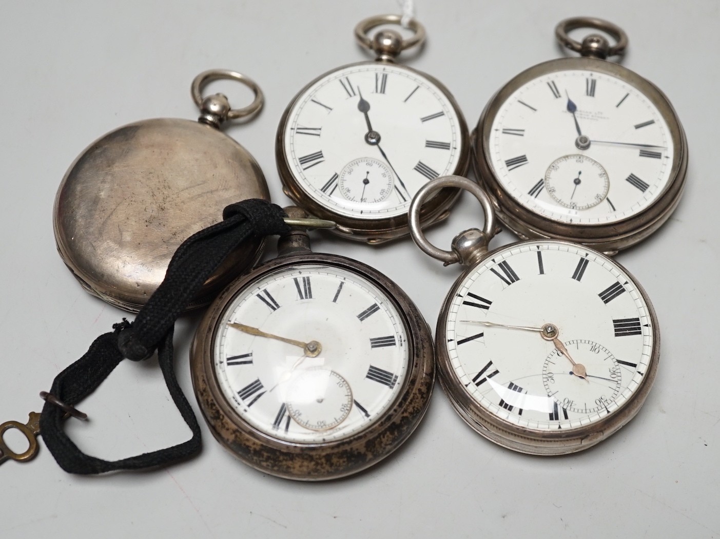 A 19th century silver pair cased keywind verge pocket watch, unsigned movement, together with three silver open faced keywind pocket watches including Fearn, Cornhill and a silver hunter pocket watch by Tanner of Lewes.